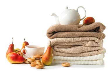 Beautiful autumn composition with warm clothes and tea on white background clipart
