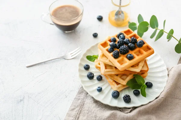 Plate with sweet tasty waffles on white table — Stock Photo, Image