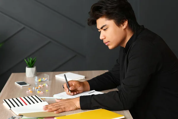 Portrait of handsome Asian student preparing for exam at home — Stock Photo, Image