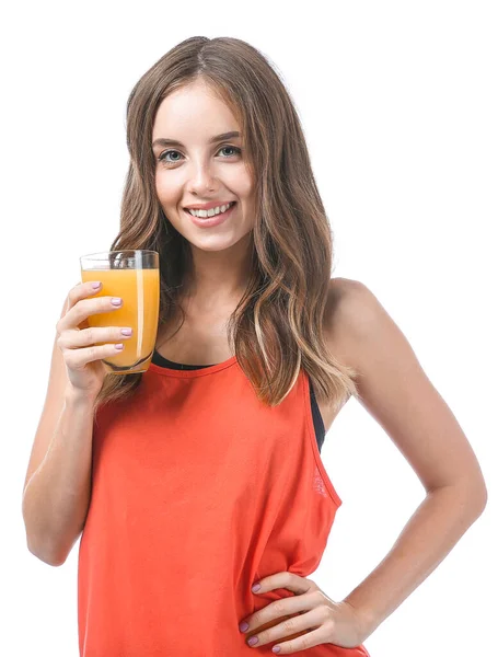 Mulher bonita com suco de laranja no fundo branco — Fotografia de Stock