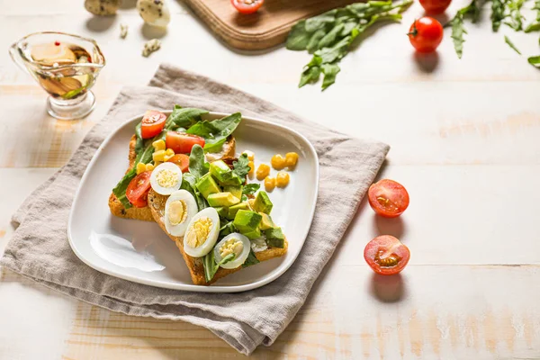 Plate with tasty sandwiches on white table — Stock Photo, Image