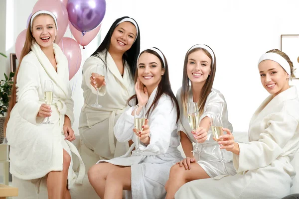 Happy young women drinking champagne at hen party — Stock Photo, Image