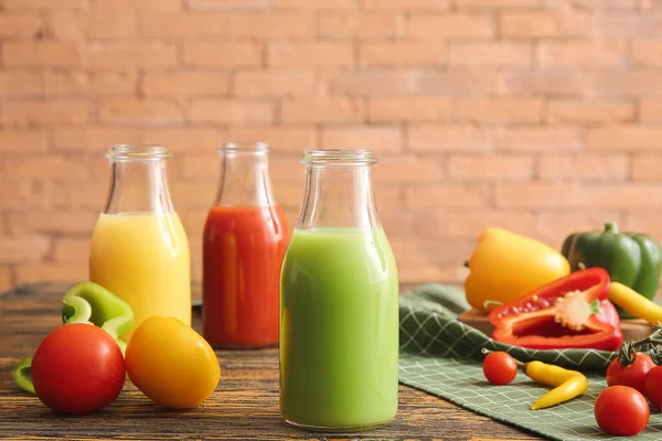 Bottles of fresh juice on table — Stock Photo, Image