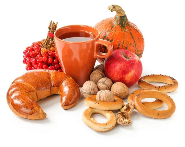 Beautiful autumn composition with pumpkins, sweets and cup of tea on white background — Stock Photo, Image