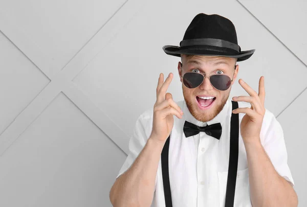 Excited young man on light background — Stock Photo, Image