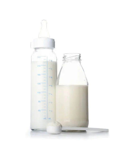 Bottles of baby milk formula on white background — Stock Photo, Image