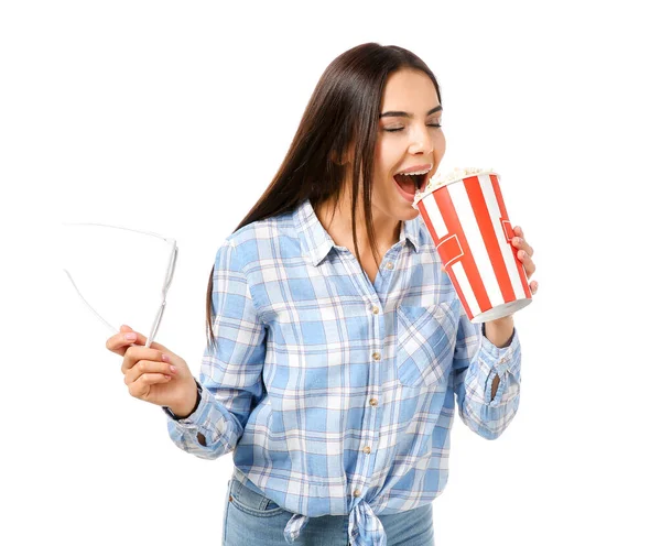 Young woman eating popcorn on white background — Stock Photo, Image