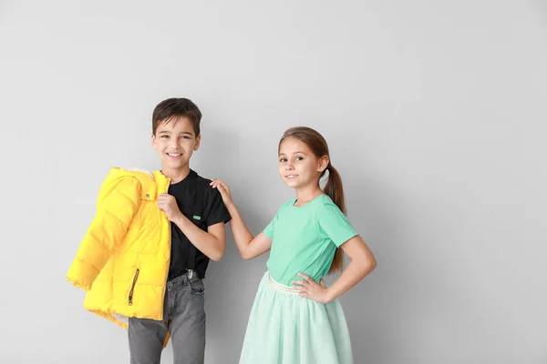 Cute fashionable children on light background — Stock Photo, Image