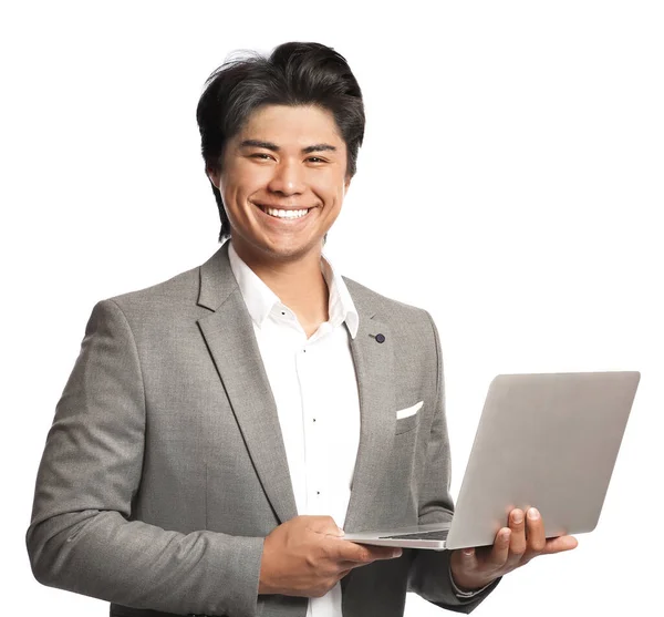 Portrait of handsome Asian businessman with laptop on white background — Stock Photo, Image