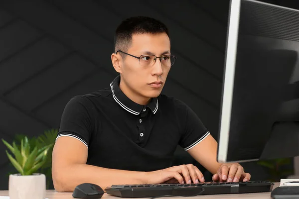 Asian programmer working on computer in office — Stock Photo, Image