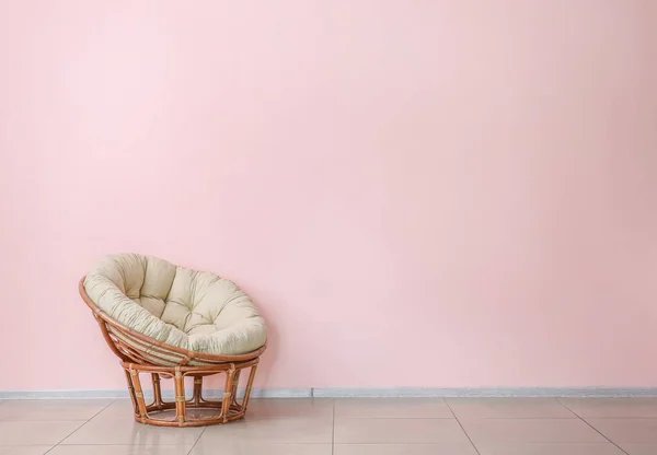 Soft armchair near color wall — Stock Photo, Image