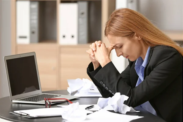 Stressed woman at workplace in office — Stock Photo, Image