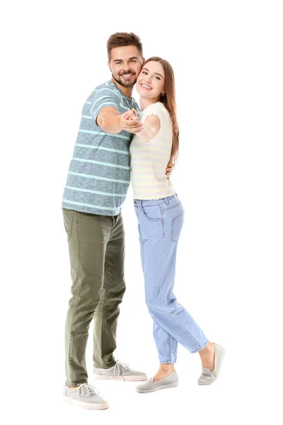 Retrato de pareja joven bailando sobre fondo blanco — Foto de Stock