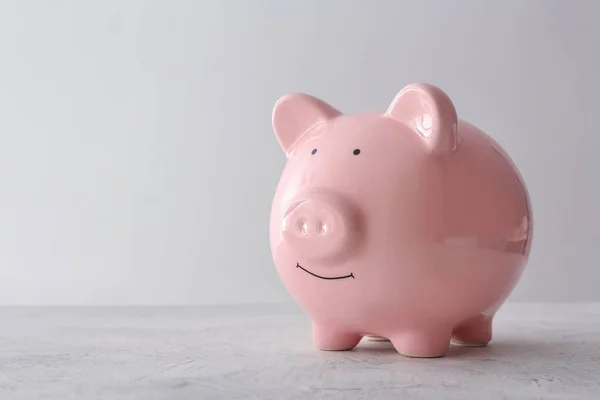 Piggy bank on light background — Stock Photo, Image