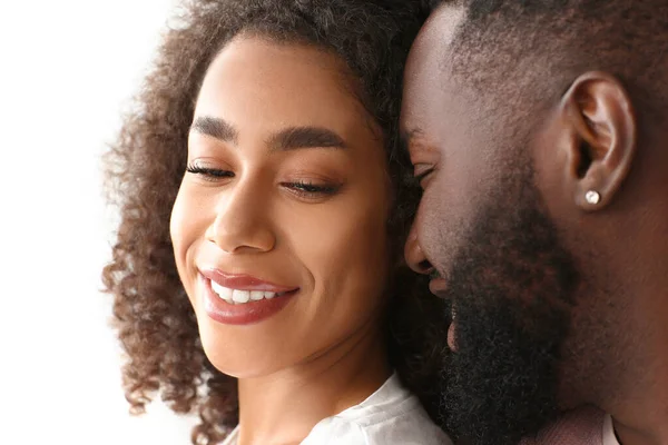 Portrait of happy African-American couple on white background — Stockfoto