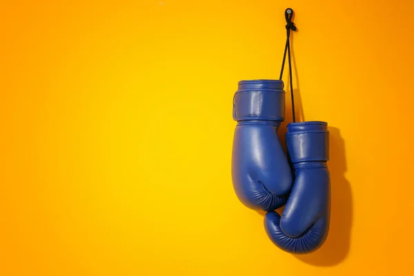 Pair of boxing gloves on color background — Stock Photo, Image