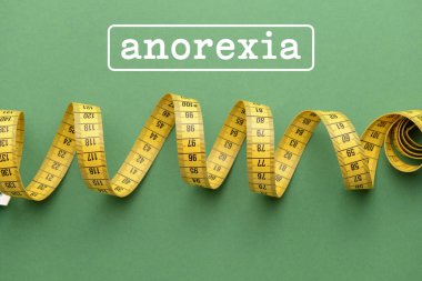 Renk arkaplanı üzerindeki bant ve sözcük ANOREXIA ölçülüyor