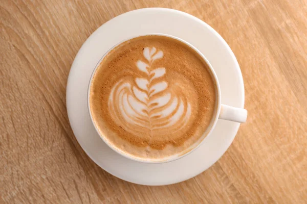 Tasse Leckeren Kaffee Auf Holztisch — Stockfoto