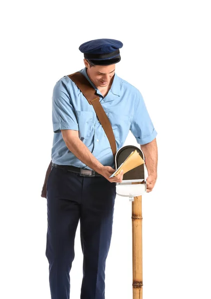 Hermoso Joven Cartero Poniendo Cartas Buzón Correo Sobre Fondo Blanco —  Fotos de Stock