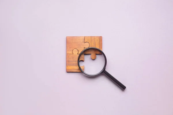 Pieces Jigsaw Puzzle Magnifier Light Background Unity Concept — Stock Photo, Image