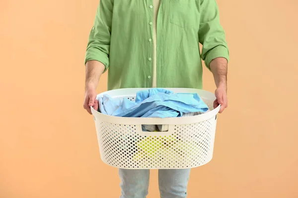 Young Man Laundry Color Background — Stock Photo, Image