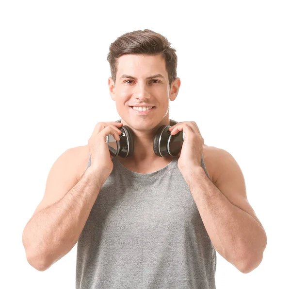 Joven Deportivo Con Auriculares Sobre Fondo Blanco — Foto de Stock