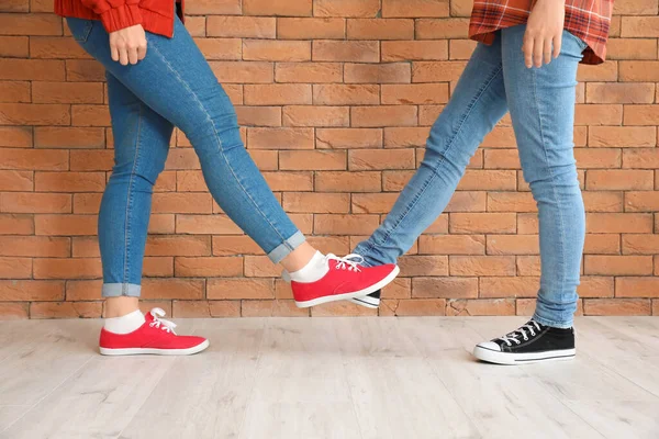 Young Women Greeting Each Other Brick Wall Concept Social Distance — Stock Photo, Image