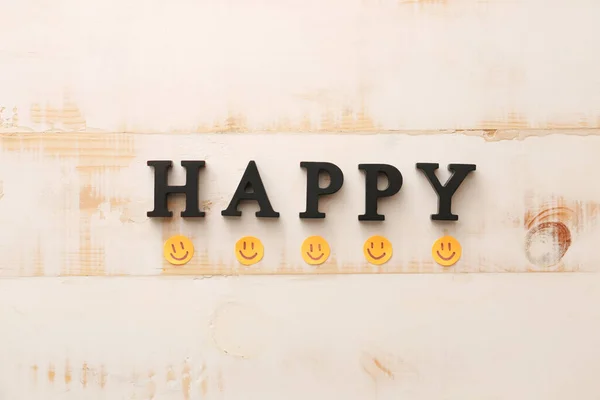 Word Happy Paper Smiles White Wooden Background — Stock Photo, Image