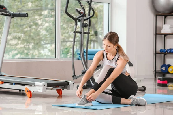 Sporty Young Woman Tying Shoelaces Gym — Stock Photo, Image