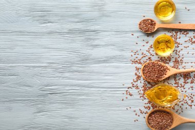 Ahşap masada keten yağlı kompozisyon