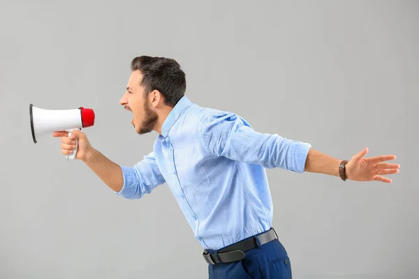 Screaming Young Businessman Megaphone Grey Background — Stock Photo, Image