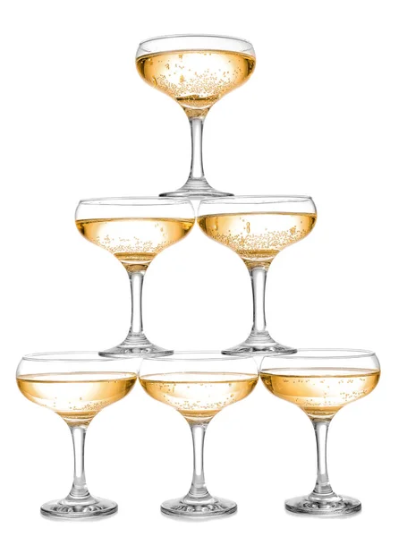 Tower made of glasses with champagne on white background