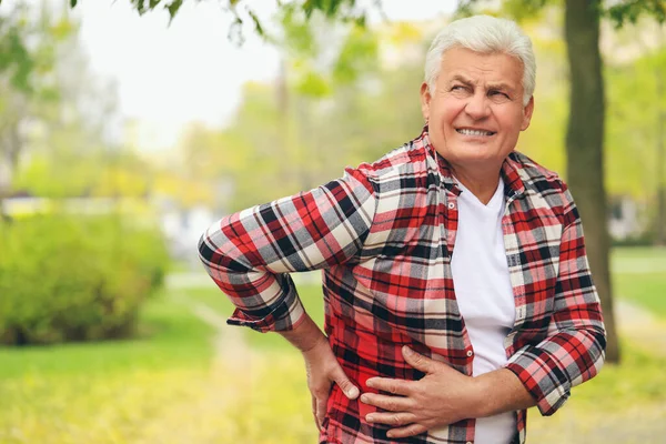 Senior Man Suffering Back Pain Outdoors — Stock Photo, Image