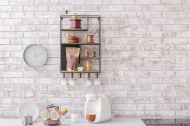 Shelf with kitchenware on brick wall clipart