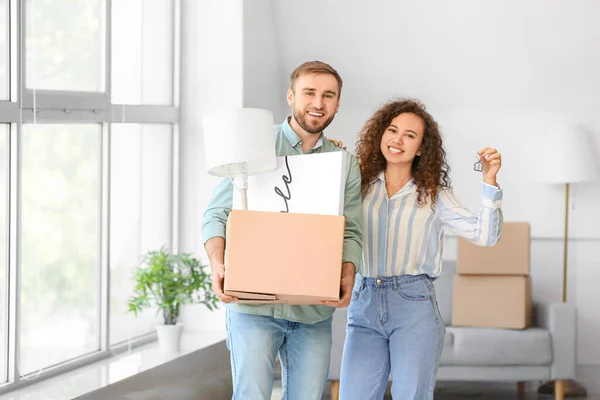 Young couple in their new flat on moving day