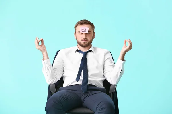 Meditating Young Businessman Sitting Chair Color Background Day Concept — Stock Photo, Image