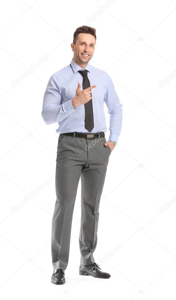 Portrait of handsome businessman showing something on white background