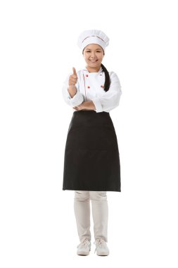 Güzel Asyalı şef beyaz arka planda baş parmak hareketi gösteriyor.