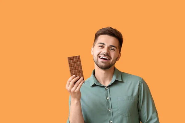 Handsome Young Man Tasty Chocolate Color Background — Stock Photo, Image