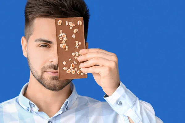 Handsome Young Man Tasty Chocolate Color Background — Stock Photo, Image