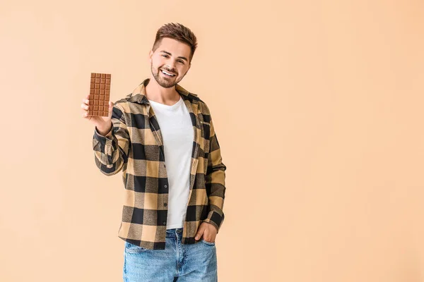 Handsome Young Man Tasty Chocolate Color Background — Stock Photo, Image