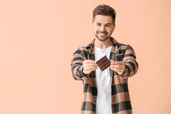 Handsome Young Man Tasty Chocolate Color Background — Stock Photo, Image