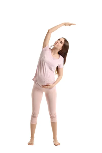 Mujer Embarazada Joven Practicando Yoga Sobre Fondo Blanco —  Fotos de Stock