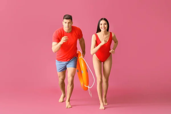 Running Beach Rescuers Lifebuoy Color Background — Stock Photo, Image