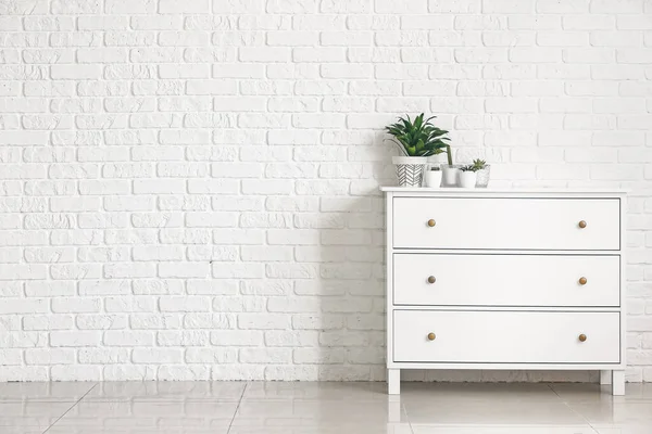 Green Houseplants Chest Drawers White Brick Wall — Stock Photo, Image