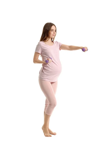 Mujer Embarazada Joven Entrenando Contra Fondo Blanco —  Fotos de Stock
