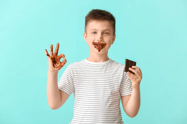 Cute Little Boy Chocolate Showing Color Background — Stock Photo, Image
