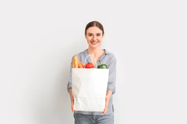 Young Woman Holding Bag Food Light Background — Stock Photo, Image