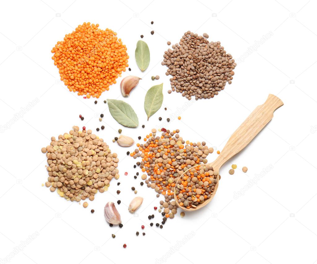 Raw lentils with spices on white background