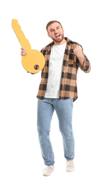 Joven Feliz Con Gran Llave Papel Sobre Fondo Blanco —  Fotos de Stock